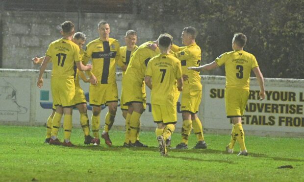 The Wick players celebrate Steven Anderson's goal which put them 3-2 up against Clachnacuddin