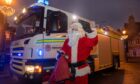 Santa arrives in Huntly after a last-minute community effort to ensure some festive cheer