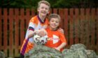 Hearts of gold: Brothers Logan and Aiden Taylor say their granda has inspired them to raise over £4k for charity. Picture, Kath Flannery.