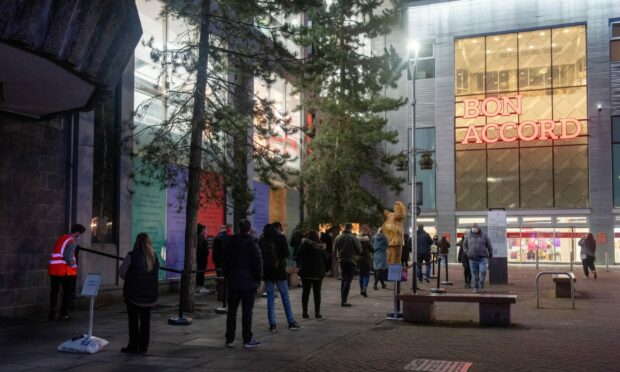 People queuing to be ‘boosted by the bells’ outside the old John Lewis store turned vaccination centre in Aberdeen (Photo: Kath Flannery/DCT Media)