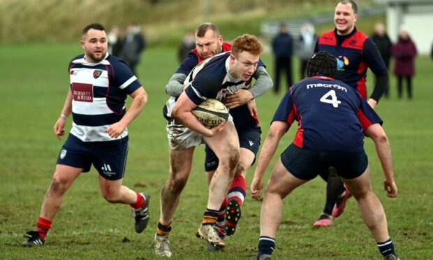 Angus Jack on the charge for Aberdeen Exiles in the 2021 Boxing Day match at Rubislaw. Image: Kami Thomson/ DC Thomson.