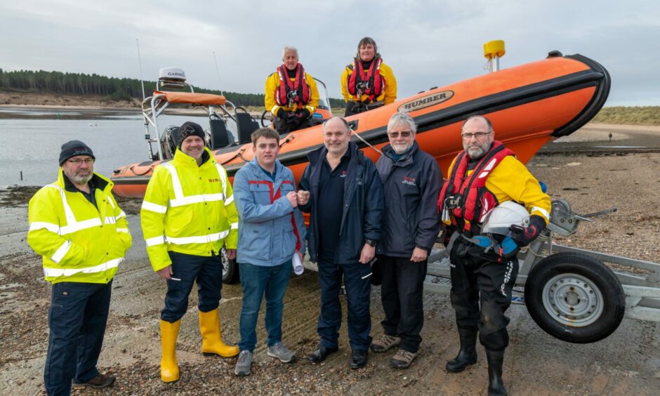 Hopeman teen Zander Craib with Miro volunteers and the charity's lifeboat.