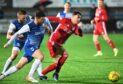 Peterhead midfielder Grant Savoury in action against Montrose