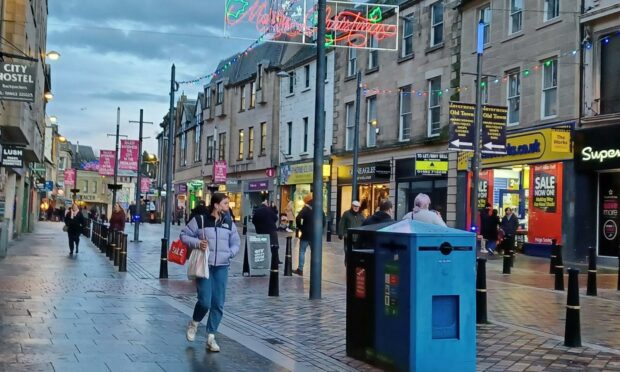 Shoppers on Inverness High Street.