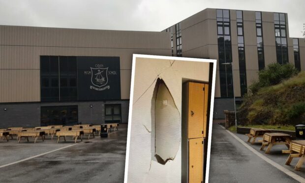 A council is refusing to explain how a human-sized gaping hole appeared in the wall of a school building.