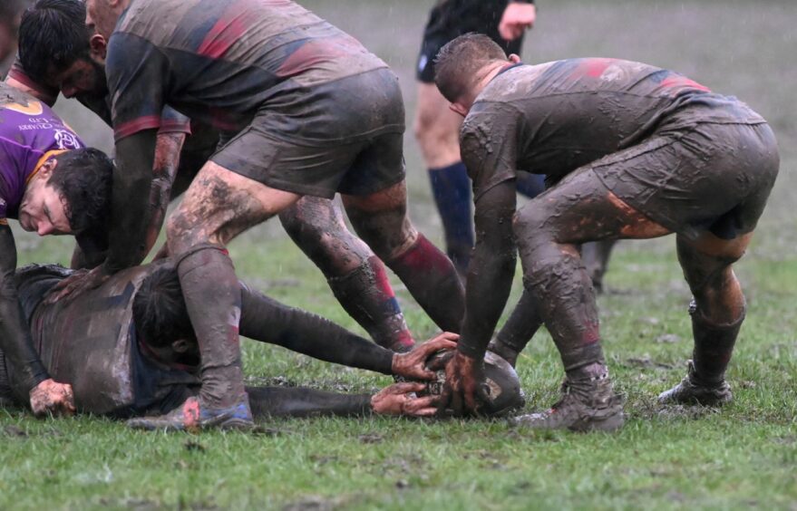 Aberdeen Grammar in their mudbath against Marr last weekend