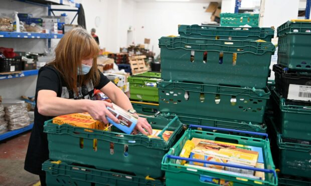Volunteers at Cfine in Aberdeen packing donations last Christmas. Image: Paul Glendell / DC Thomson.