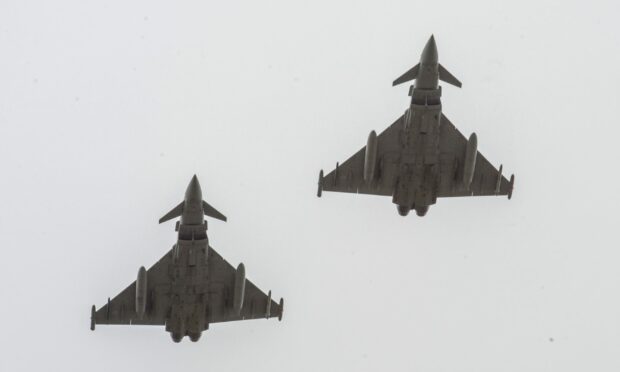 Two Typhoon jets in close proximity viewed from underneath.