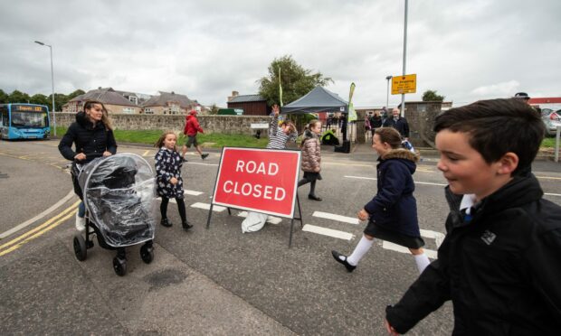 Children outside New Elgin Primary School when the street is closed.