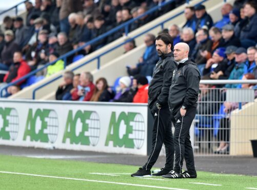 Gordon Young, right, with Cove manager Paul Hartley, has been banned for breaching gambling rules by the SFA