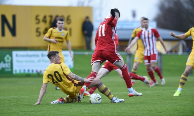 Dale Wood, left, of Forres tries to tackle Formartine's Kevin Hanratty