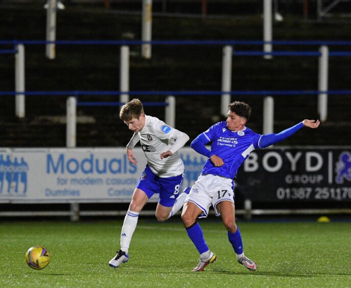 Cove Rangers midfielder Blair Yule tussles with Niyah Joseph