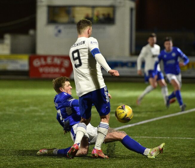 Mitch Megginson tussles with Wullie Gibson