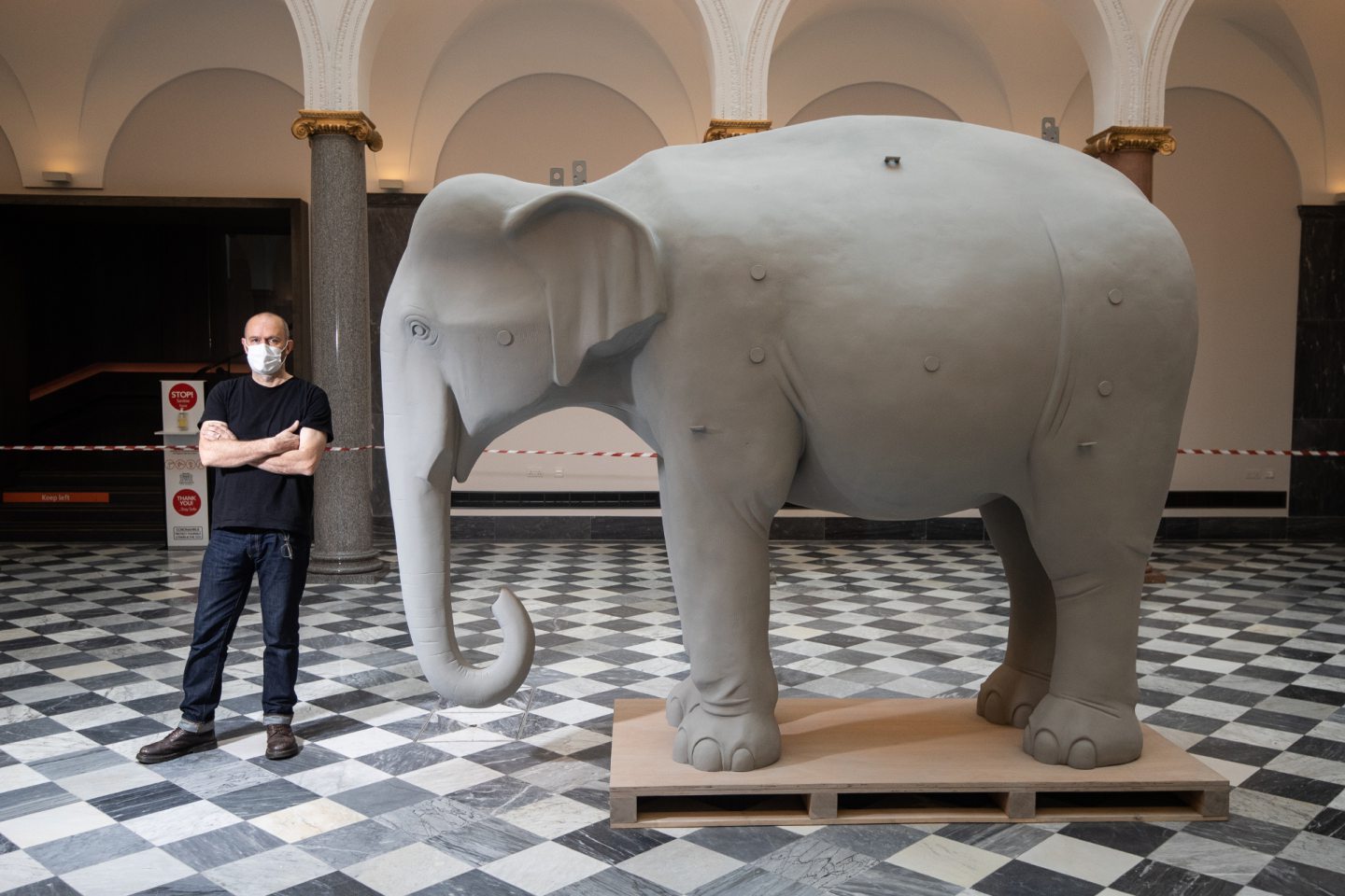 Kenny Hunter beside an elephant, part of his Sculpture Court exhibition