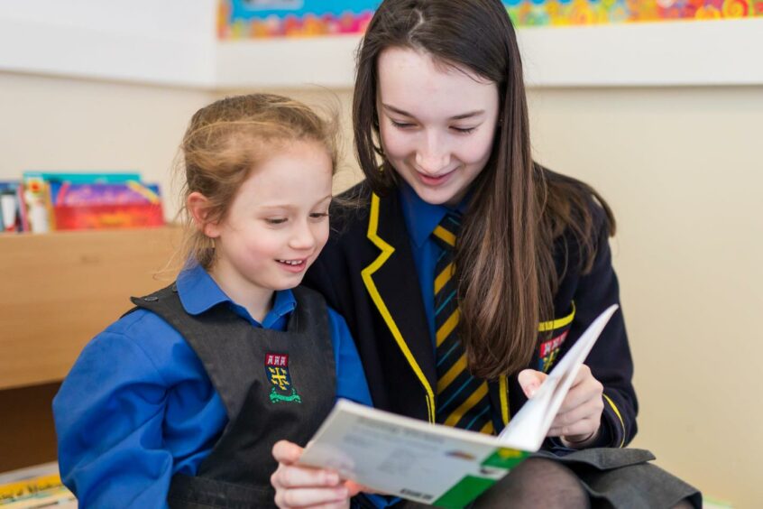 Pupils at St Margaret's School (two girls reading)