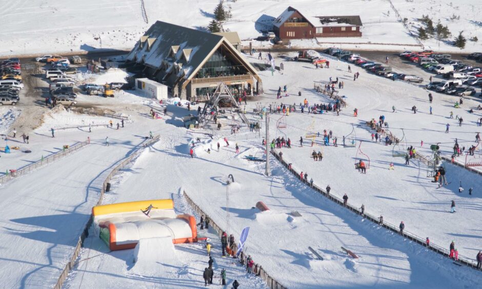 An aerial view of The Lecht with skiiers enjoying the snow. 