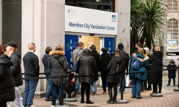 People queue at Aberdeen's city centre vaccination centre in the premises of the old John Lewis store (Photo: Wullie Marr/DCT Media)