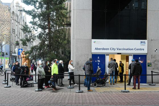 People queueing at the city centre John Lewis. Picture by Wullie Marr.