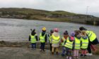 Out and about: School life in Orkney exposes children to the elements, but also the beauty of island life.