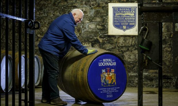 Royal Lochnagar distillery manager Sean Phillips with special cask carrying the royal arms