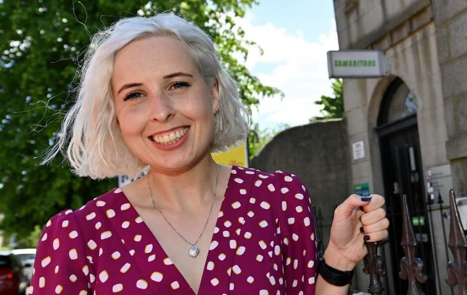 Smiling woman in sunshine