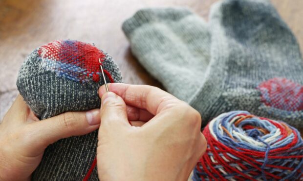 Socks used to be darned, not binned (Photo: bonchan/Shutterstock)