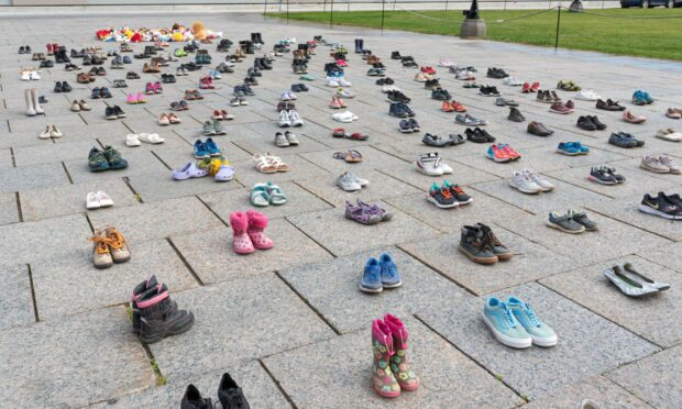 A poignant memorial  at Parliament Hill to honour the lives of 215 indigenous children whose remains were found in a mass grave in Kamloops.