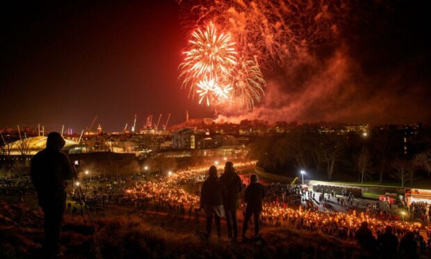 The Hogmanay torchlight procession in Edinburgh during 2019. This year's celebration has been called off (Photo: Ian Georgeson/Shutterstock)