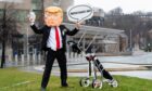 A member of the global citizens movement Avaaz wearing a mask of former US President Donald Trump protests outside the Scottish Parliament building earlier this year (Photo: Ian Georgeson/AP/Shutterstock)