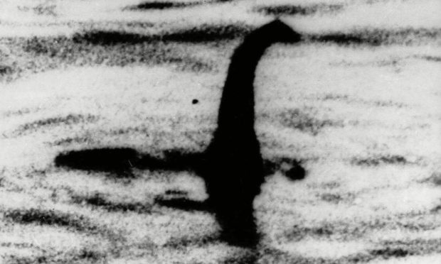 A shadowy shape that some people say is a photo of the Loch Ness monster in Scotland. Photo by Uncredited/AP/Shutterstock.