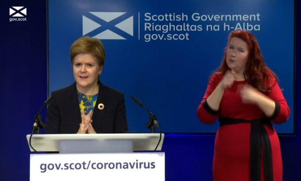 Nicola Sturgeon reacting to Russell Borthwick's comments during a question session