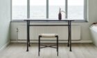 The stripped back simplicity of a Skagerak Vent Stool from Nest, a table and a view.
