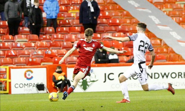 Aberdeen's Calvin Ramsay puts in a cross against Edinburgh City.