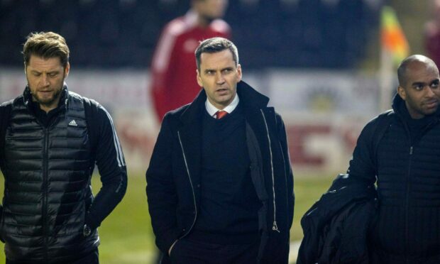 Dons boss Stephen Glass, centre, with coaches Allan Russell, left, and Henry Apaloo, right