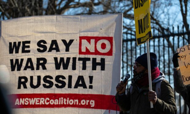 Demonstrators with Code Pink, Answer Coalition and other groups gather in front of the White House  to protest against potential U.S. and NATO military escalation with Russia as the threat of an invasion into Ukraine continues. Photo by Bryan Olin Dozier/NurPhoto/Shutterstock