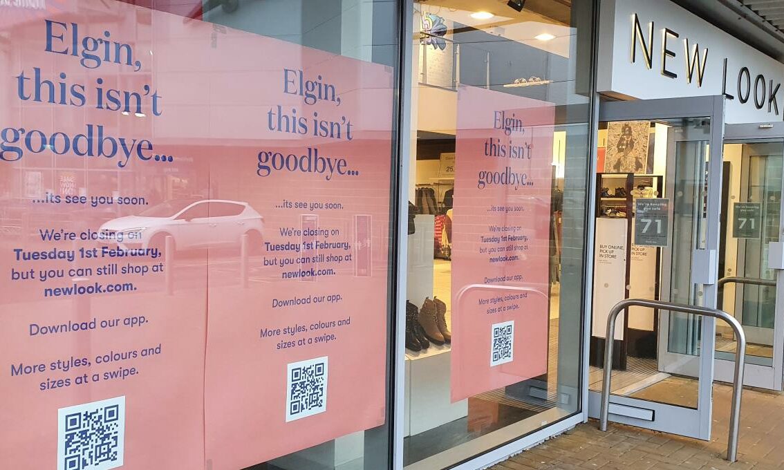 Closing signs in the New Look store in Elgin that read 'Elgin, this isn't goodbye... its see you soon.' with a QR code for the app at the bottom.