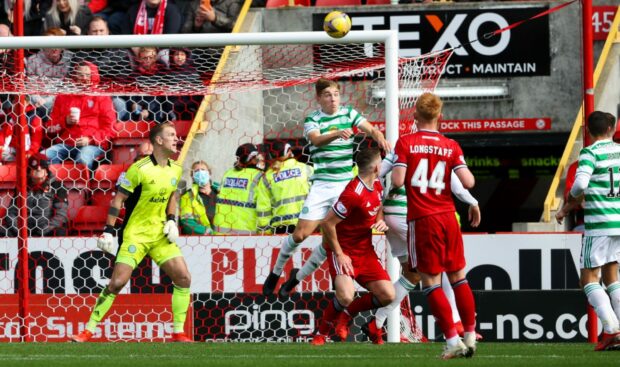 Lewis Ferguson scores to make it 1-1 as Adam Montgomery attempts to clear during a cinch Premiership match between Aberdeen and Celtic at Pittodrie in October.