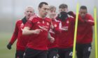 Jack MacIver, centre, training with Aberdeen first team players, from front, Scott Brown - the now-departed captain - Jonny Hayes, Calvin Ramsay and Funso Ojo.