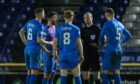 Inverness players complain to referee Willie Collum about Queen of the South's second goal.