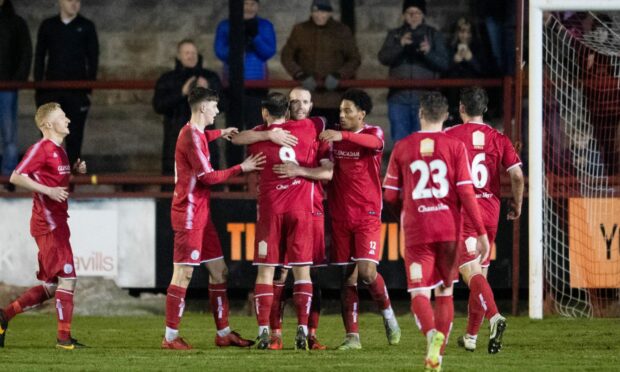 Brechin players celebrate as Garry Woods makes it 3-0 against Fort William.