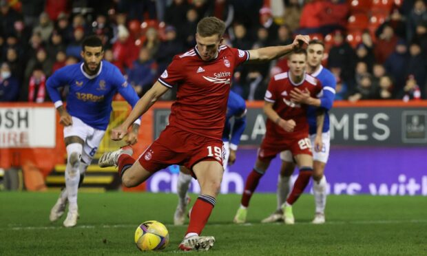 The ball appears to move slightly as Lewis Ferguson scores for Aberdeen from the penalty spot against Rangers.