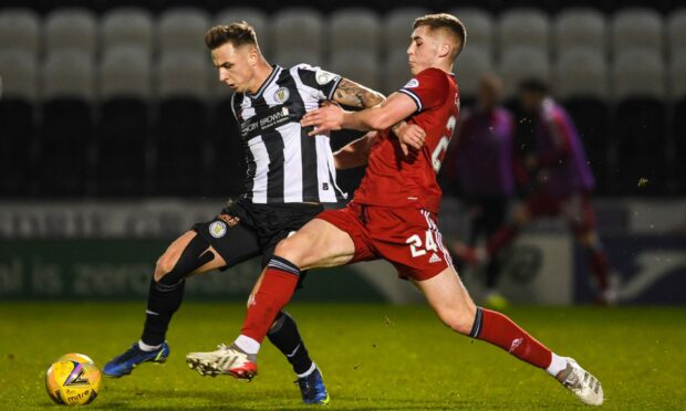 St Mirren's Eamonn Brophy and Aberdeen left-back Dean Campbell battle for the ball.