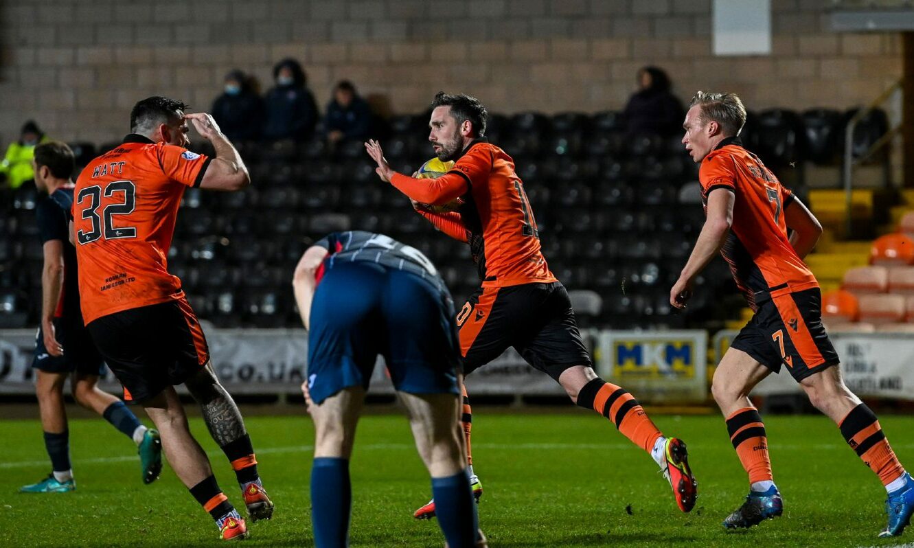 Nicky Clark celebrates netting a penalty for Dundee United.