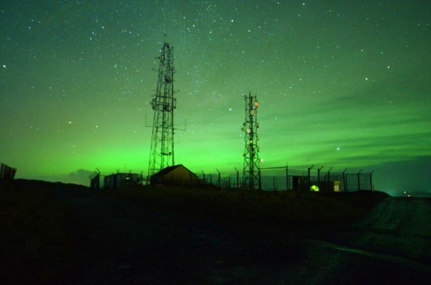 The green colour lights up the sky at Wideford Hill, Orkney. Picture by Samuel Ramsay.