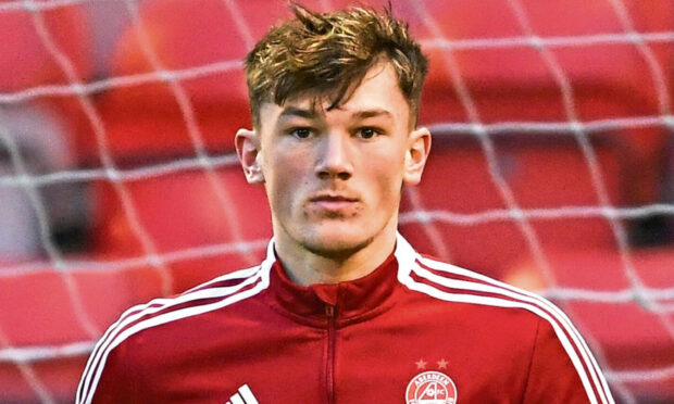 ABERDEEN, SCOTLAND - DECEMBER 26: Aberdeen's Calvin Ramsay warms up before a Cinch Premiership match between Aberdeen and Dundee at Pittodrie Stadium, on December 26, 2021, in Aberdeen, Scotland. (Photo by Ross MacDonald / SNS Group)