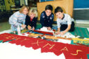 1990 - Primary 6 pupils Debbie Sullivan, Jill Heenan, Christopher Blair and Gary Peel making a Christmas frieze during art class