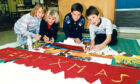 1990 - Primary 6 pupils Debbie Sullivan, Jill Heenan, Christopher Blair and Gary Peel making a Christmas frieze during art class