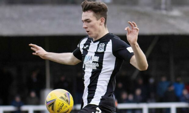 Defender Evan Towler in action for Elgin against Albion Rovers.