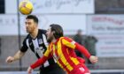 Elgin City loanee Ross Draper challenges Albion Rovers' Max Wright. Photo by Bob Crombie