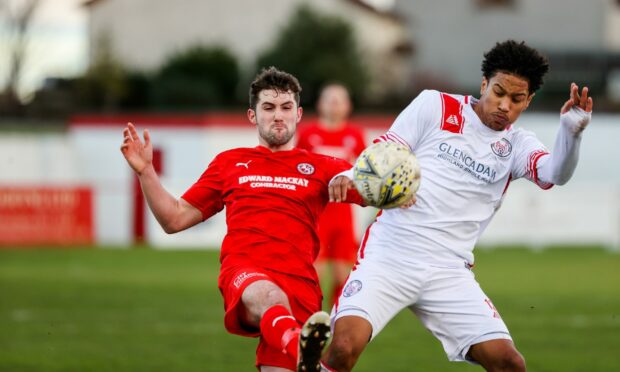 Brora Rangers' Tom Kelly, left, and Brechin City's Seth Patrick compete for possession